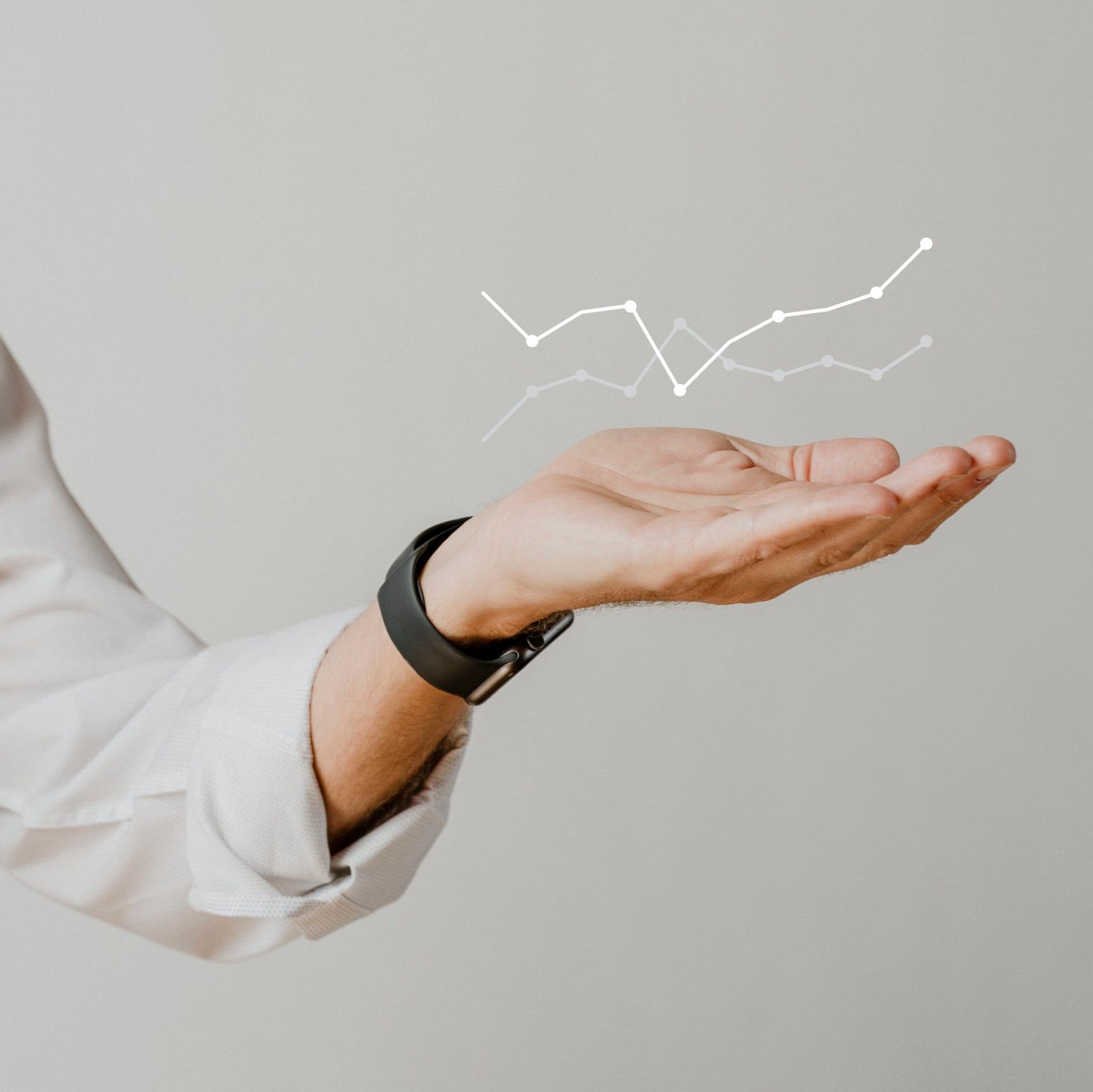Digital graph with businessman hand overlay